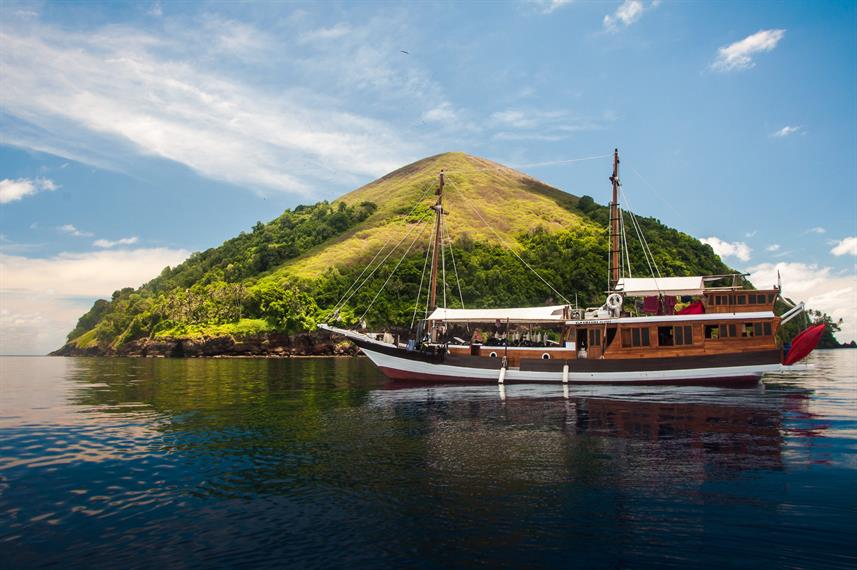 Kira sails past island.