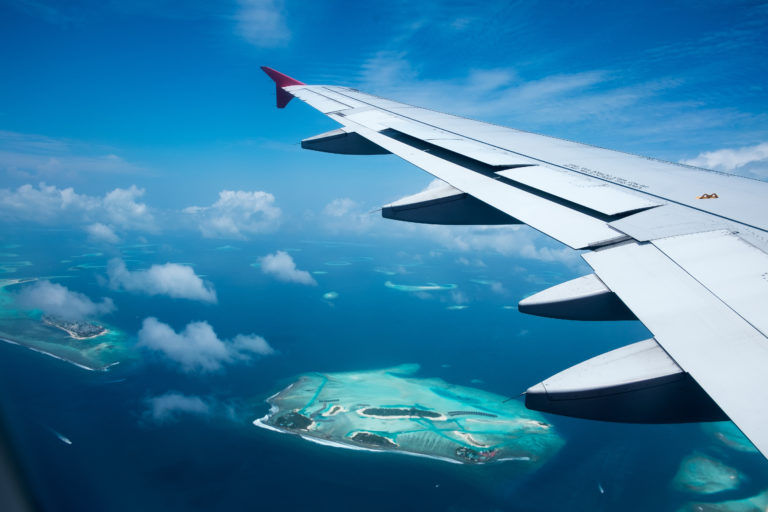 Plane flying over maldives.