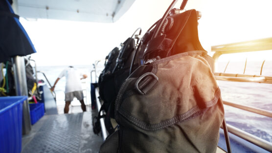 Close up of bcd jackets on boat.