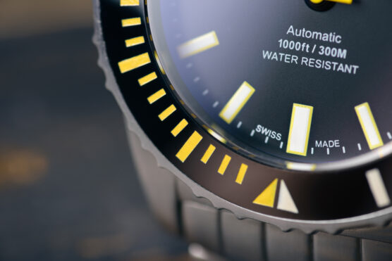 Swiss,Made,Diver,Watch,On,Blurry,Background.,Professional.,Closeup,Of