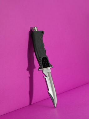 Scuba,Diving,Knife,On,Pink,Background
