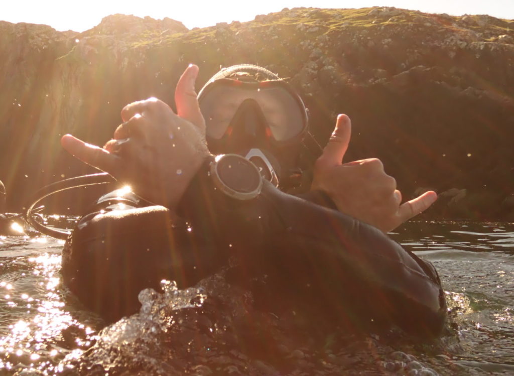 Alex - Founder and CEO of Diving Squad showing off his Suunto D5 dive computer.