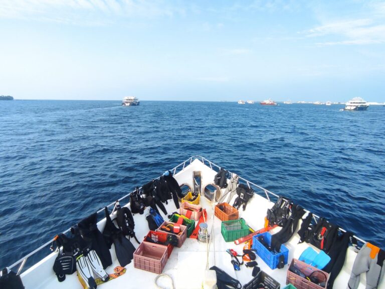 Bow of Iruvai Liveaboard with ocean in front of it.