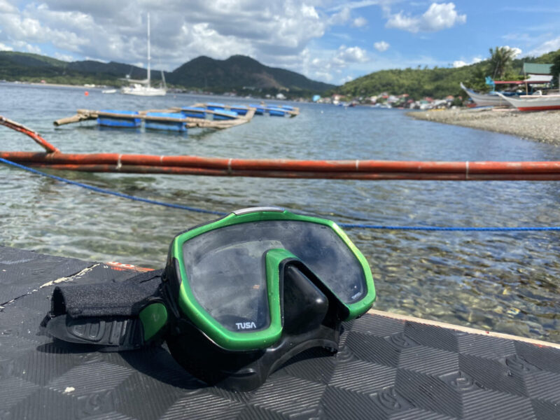 Scuba mask with Batangas in the background.