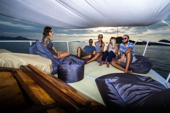 Sundeck of Busy Girl with guests on beanbags