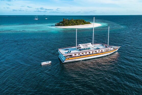 Nautilus 2 sailing past tiny island