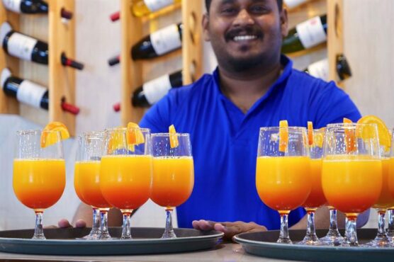 Fresh cocktails served up by happy crew member at the bar!