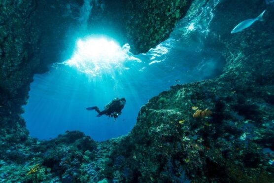 diver exploring cave