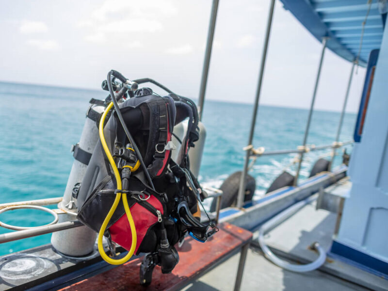 Travel BCD perched on dive deck of boat in the gulf of thailand.